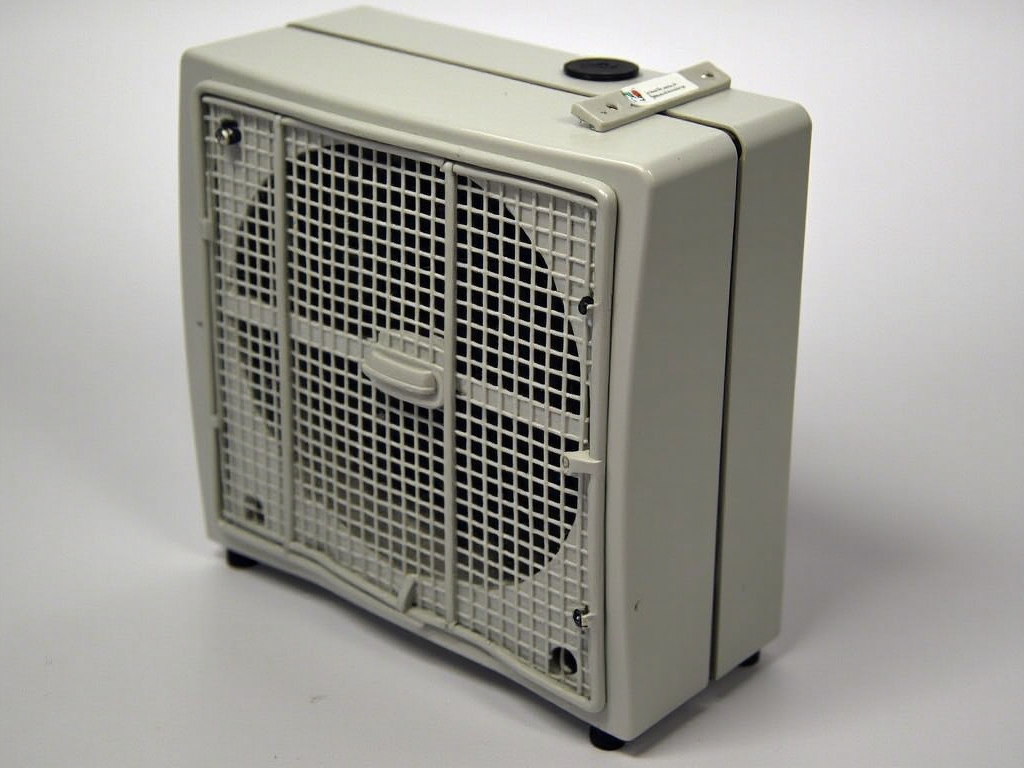 Gray portable space heater with controls on top, against a white background.